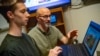 Luke Trinity and Scott Merrill are part of a team of University of Vermont researchers using video games and computational models to understand human behavior. (Sally McCay/University of Vermont)