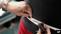 FILE - A subject's waist is measured during an obesity prevention study in Chicago, Illinois, Jan. 20, 2010. The U.S. obesity rate is about 40%, according to a 2021-2023 survey of about 6,000 people.