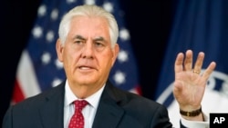 Secretary of State Rex Tillerson gestures while speaking to State Department employees at the State Department in Washington, May 3, 2017.