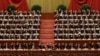 China's leaders raise their hands to show approval for a work report at the closing ceremony for the 18th Communist Party Congress, Beijing, November 14, 2012. 
