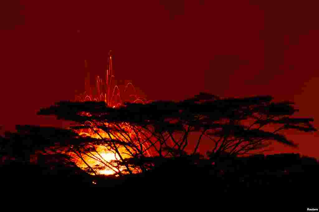 A 17th lava fissure erupts hundreds of feet in the air during a volcano outbreak in Pahoa, Hawaii.