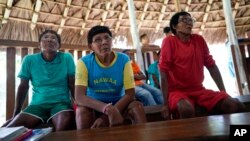 FILE - Indigenous elders attend a hearing on the Waimiri-Atroari reserve in Brazil's Amazon state, Feb. 27, 2019.