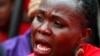 A woman attends a demonstration calling on the government to rescue the kidnapped Chibok school girls, outside the defense headquarters in Abuja, Nigeria, May 6, 2014. 