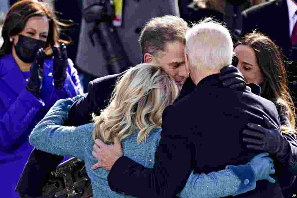 Vice President Kamala Harris applauds as President Joe Biden is embraced by his son Hunter, first lady Jill Biden and daughter Ashley, during the 59th presidential inauguration in Washington, D.C.