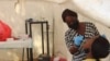 A woman is tested for COVID-19 in Abuja, Nigeria, Nov. 29, 2021.