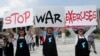 Protesters shout slogans to oppose planned joint military exercise between South Korea and the United States near the U.S. embassy in Seoul, South Korea, Aug. 5, 2019.