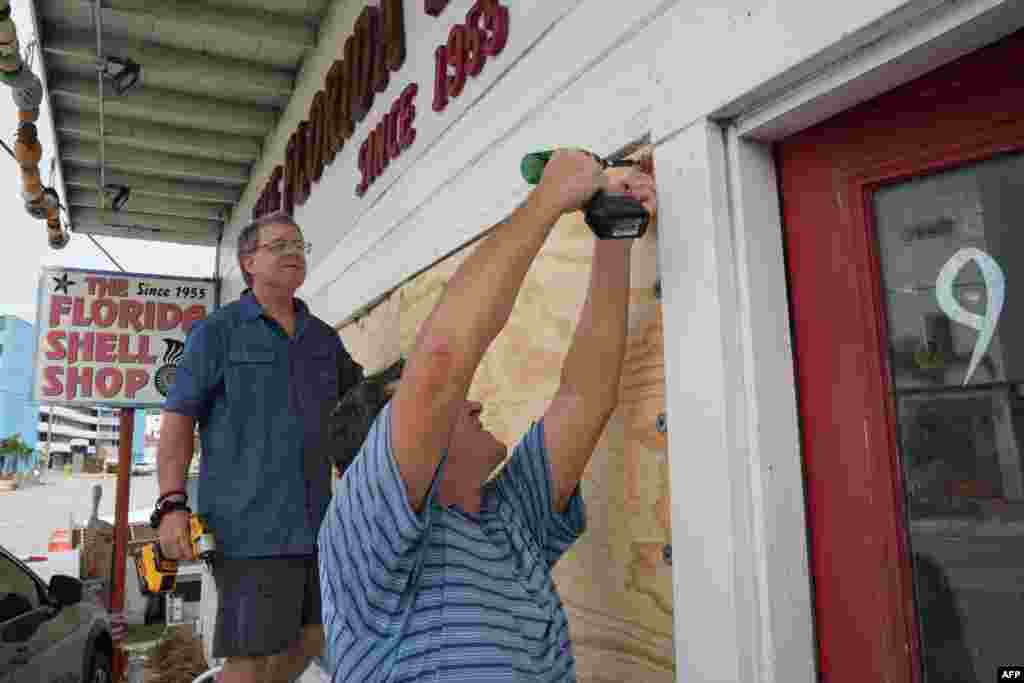 Residents board up a sea shell store ahead of Hurricane Milton’s expected landfall in the middle of this week in Treasure Island, Florida, Oct. 7, 2024.
