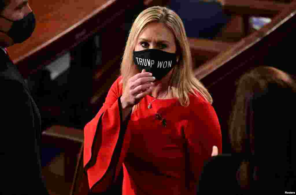 U.S. Rep. Marjorie Taylor Greene (R-GA) wears a "Trump Won" face mask as she arrives on the floor of the House to take her oath of office as a newly elected member of the 117th House of Representatives in Washington, D.C. Jan. 3, 2021.